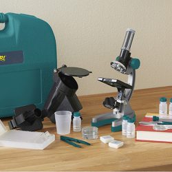 Contents of the Geovision Elite 98 Piece Microscope Set on a desk