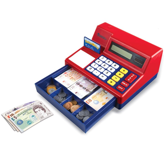 Children's cash register at an angle, with play money