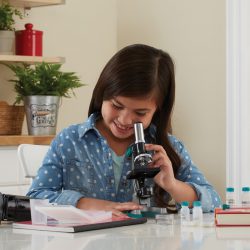 Child using the Geovision Elite 98 Piece Microscope Set