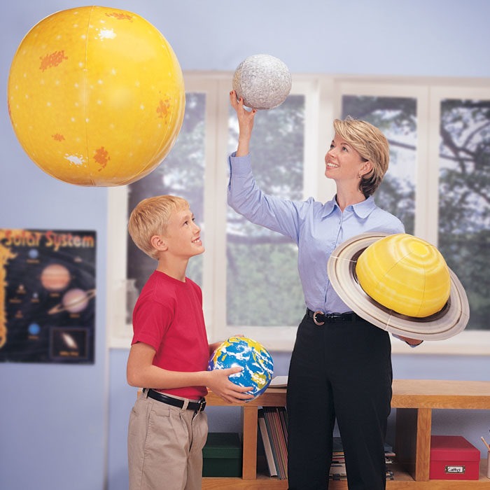 Adult and child playing with the Learning Resources Giant Inflatable Solar System