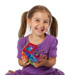 Child holding a 3d hexagon model made using Magformers Rainbow 14 Piece Magnetic Construction Set