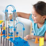 Child playing with the Learning Resources City Building set