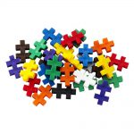 Multicolured pieces from the Plus Plus Basic Mix Tube