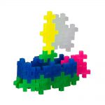 A boat made using pieces from the Plus Plus Neon Mix Tube