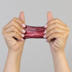2 hands stretching the Crazy Aaron's Thinking Putty - Burmese Ruby