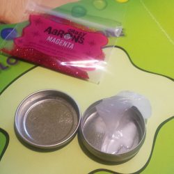 A tin of clear putty, ready for mixing!