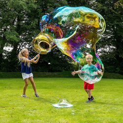 Two children making giant bubbles as an example of the Bubble Bonkaz Giant Bubble Solution in action