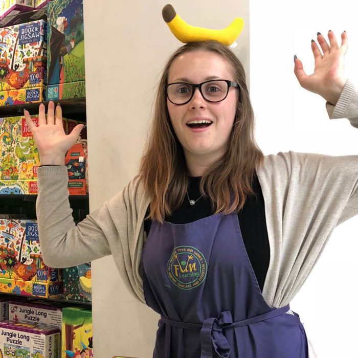 A Fun Learning staff member Monkeying Around with a banana on her head