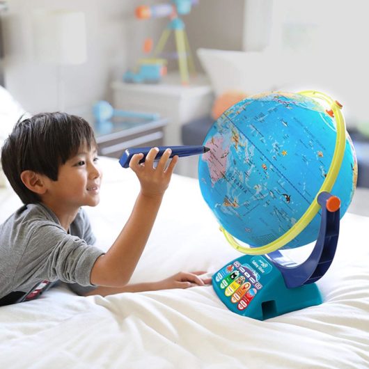 Child using the GeoSafari Jr Talking Globe