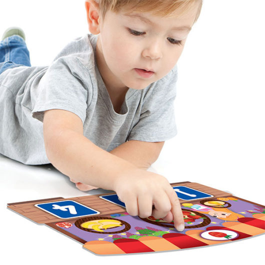 Child playing with the tactile touch bingo pieces