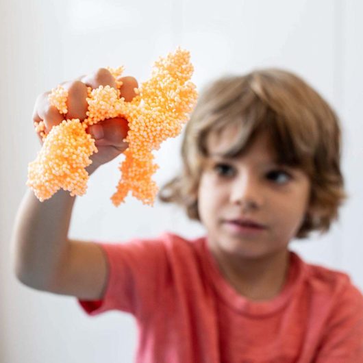 Child playing with lLay Foam